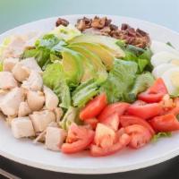 Chopped Cobb Family · Romaine, field greens, seared chicken, avocado, bacon, tomato, cage-free egg, blue cheese dr...