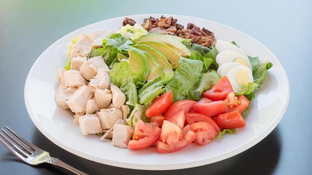 Chopped Cobb Family · Romaine, field greens, seared chicken, avocado, bacon, tomato, cage-free egg, blue cheese dressing