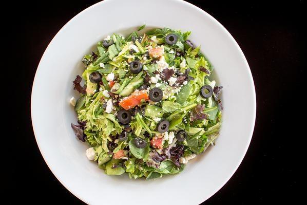 Greek To Me Family · Field Greens, spinach, black olives, tomato, raw red onion, garbanzo beans, cucumber, feta cheese, balsamic vinaigrette dressing