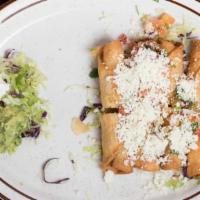 Taquitos Dorados · Corn or flour tortillas rolled and filled with beef or chicken, deep fried served with guaca...