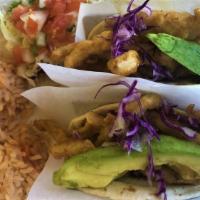 Tacos De Pescado (3) · Three fish tacos deep fried, or grilled on corn tortillas. Served with shreded cabbage, pico...
