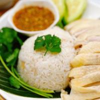 Khao Man Gai (Hainan Chicken) · Simmered chicken with ginger rice served with our signature soybean ginger sauce, cucumber a...