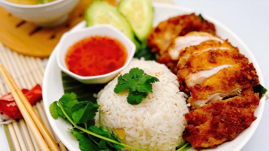 Khao Man Gai Tod (Thai-Fried Chicken) · Hand battered Thai style deep-fried chicken with ginger rice served with our homemade sweet chili sauce, cucumber and tasty winter melon soup.