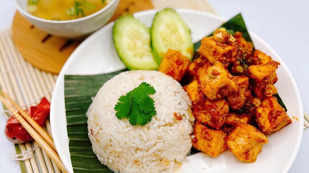 Khao Man Tofu · Our Homemade garlic sauce stir-fried crispy tofu with ginger rice, cucumber and tasty winter melon soup.