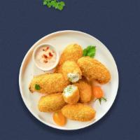 Jalapeno Caliente Poppers · Fresh dough rolled with jalapenos and 100% real cheese, then baked to perfection and brushed...