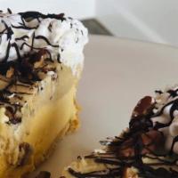 Cookie Dough Bliss Pie Slice · Graham cracker or Oreo crust with layer of ice cream and layer of cookie dough with whipped ...