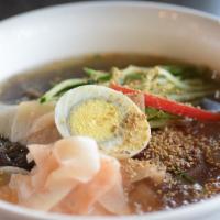 Chik-Naeng-Myun · Cold arrowroot noodles and chili sauce in beef broth soup. Served with side dishes.
