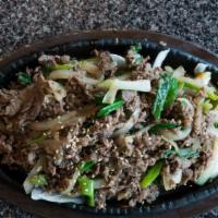Bulgogi · Korean bbq rib-eye marinated in bulgogi sauce. Served with sizzling hot stone pot rice and s...