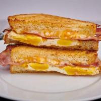 Brk - Og Breakfast Sandwich · Two eggs, any style, bacon and sharp cheddar cheese, served with garlic aioli on a buttery b...