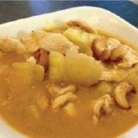 Yellow Curry · Yellow curry paste and coconut milk with carrots, white onions,  potatoes and cashew nuts