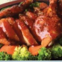 Fried Duck Volcano · Crispy half duck on bed of steamed mixed veggies. with delicious house sweet special sauce.