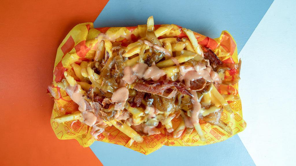 Bad Cooper · Homestyle fries, chedda whiz, bacon, caramelized onions, fry sauce.