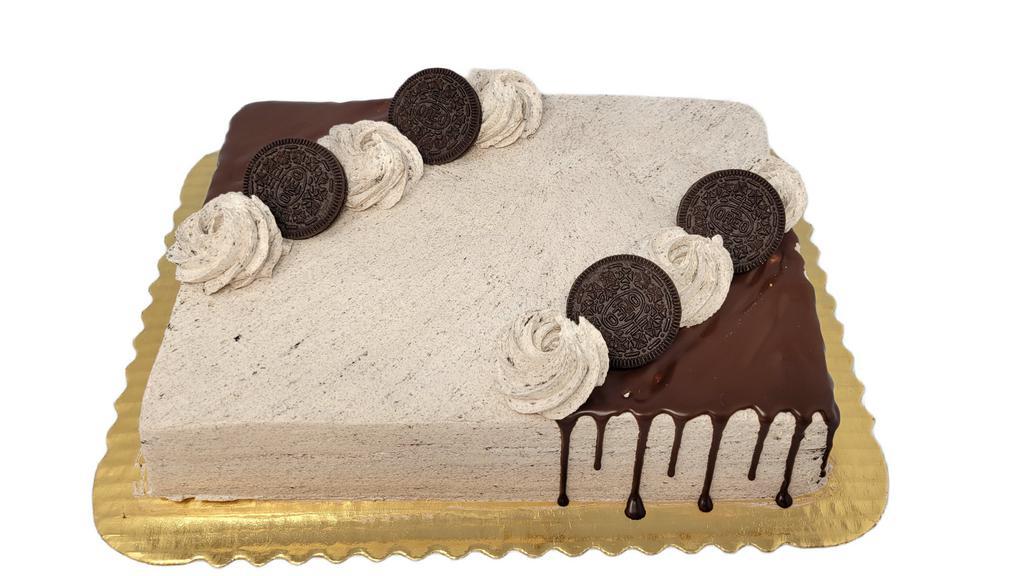 Cookies & Cream Sheet Cake · Cake is decorated as shown, made with chocolate cake and iced with a Whipped Cookies and Cream Icing. Drizzled with chocolate truffle and garnished with Oreo Cookies. If you would like writing on your cake, please specify message in Special Instructions box.