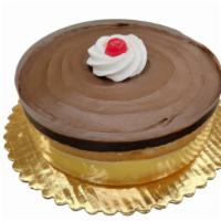 Fudge Boston · Cake is decorated as shown with white cake split and filled with Bavarian Cream. Topped with...