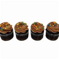 Cupcakes Chocolate · Cupcakes are topped with chocolate icing and celebration sprinkles. Choose buttercream or wh...