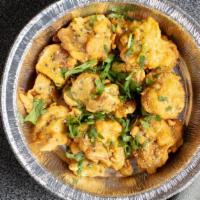 Mixed Vegetable Pakora · Deep fried potatoes, cauliflower, onion and chilies mixed with besan (chickpea flour) and sp...