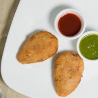 Vegetable Cutlet (2 Pieces) · Minced vegetables with spices, bread crumbed and deep fried. Served with sambar and chutney ...