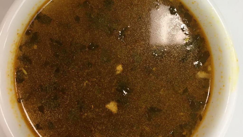 Rasam · Traditional south Indian sour and spicy soup.