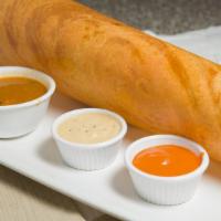 Masala Dosai · Crepes filled with potatoes and onions. Served with sambar and chutney (Vegan).