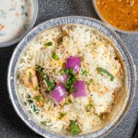 Vegetable Biryani · Aromatic saffron rice cooked with fresh vegetables and fresh herbs. Served with pachadi (Veg...