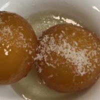 Gulab Jamun (2 Pieces) · Two pieces. Dry milk and cottage cheese balls deep fried in light syrup and rose water.