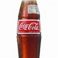 Mexican Coca Cola · Cane sugar, glass bottle.