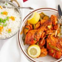 Tandoori Chicken · Chicken, marinated in yogurt with freshly ground spices and lemon juice grilled in tandoor.