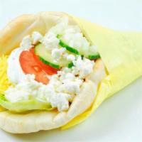 Veggie Yeero · Crisp iceberg lettuce, tomatoes, cucumbers, onions, rice wrapped in a pita bread and topped ...