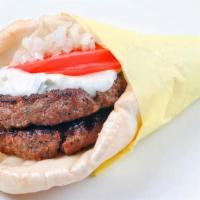 Beefteki · A spiced ground beef patty grilled and made like a yeero with onions, tomatoes, and choice o...