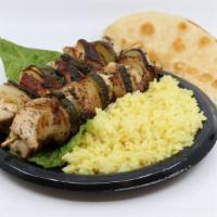 Double Chicken Souvlaki Entree · Entrees include rice or fries &  pita bread.