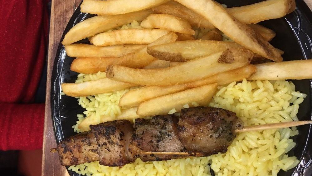 Pork Souvlaki Plate · Skewered pieces of pork spiced and grilled with a lemon accent. Plates include rice, fries, salad &  pita bread.