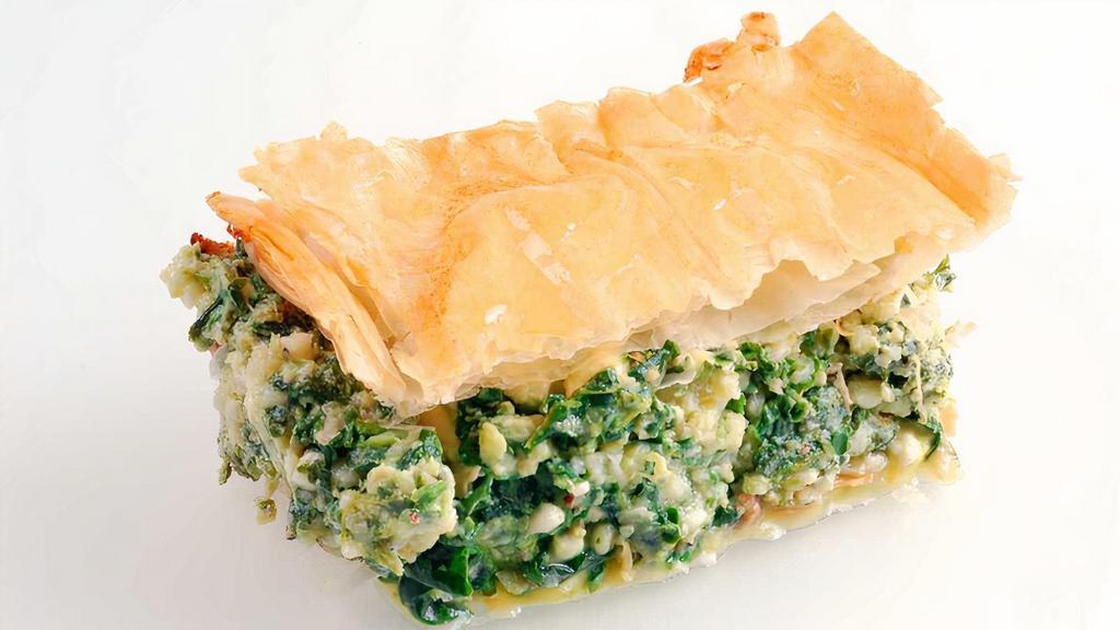 Spinach Pie (Spanakopita) · An authentic rich pie with spinach, feta cheese, and herbs. Crusted with phyllo dough and baked to perfection.