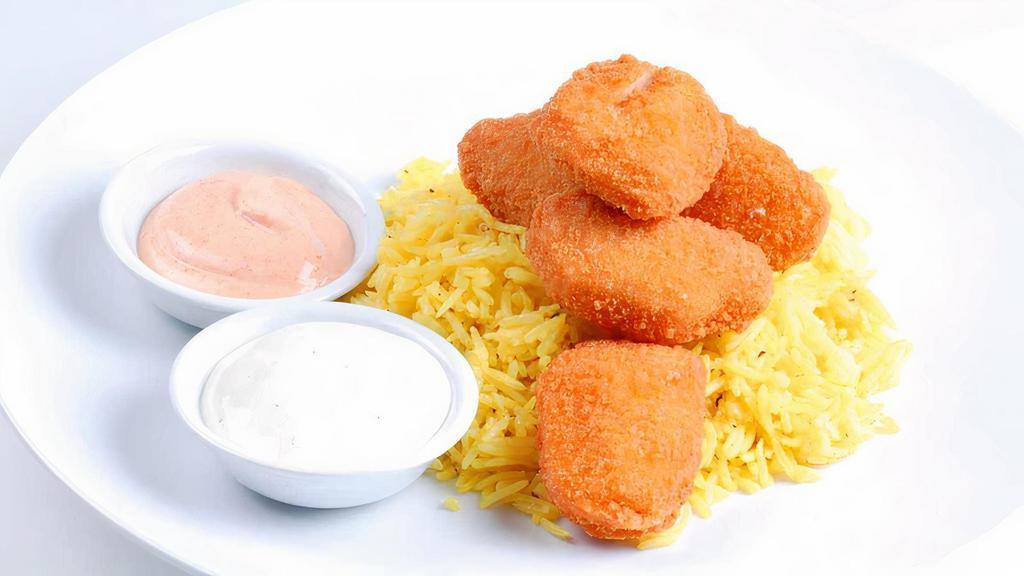 Kids Chicken Nuggets · Includes rice or fries. All kid's menu items include a kid's drink.