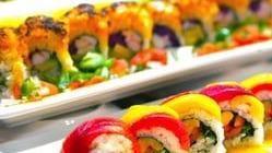 Rainbow Roll · Raw fish. California roll top with salmon, tuna and eel