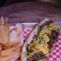 Ribeye Philly Cheesesteak · Shaved ribeye, grilled diced onions. Your choice of melted provolone or cheese whiz on a toa...
