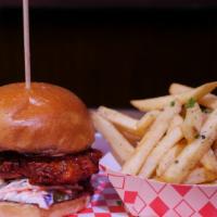 Nashville Hot Chicken · Breaded and fried chicken breast, chili oil, chipotle aioli, coleslaw, dill pickle chips, bu...