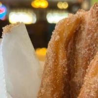 Churros · A Spanish inspired pastry, fried dough sprinkled with cinnamon and powdered sugar.