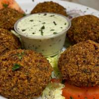 Stuffed Falafel · Deep fried chickpeas onion & parsley mixed with spices - stuffed with onions