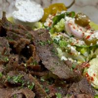Gyro Plate · Thinly cut mixture of lamb & beef mixed with our special spices - served with tzatziki sauce...