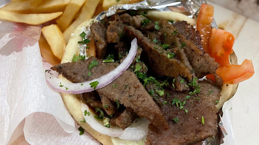 Gyro Sandwich · Thinly cut mixture of lamb & beef mixed with our special spices on a flatbread with lettuce tomato onion & tzatziki sauce