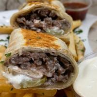 Lamb Shawarma Wrap · Lamb shawarma wrapped with tortilla bread with pickle onion tomato & garlic sauce - served w...