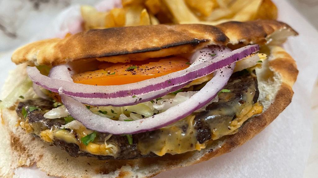 Mediterranean Burger · Marinated mixture of ground beef & onion charbroiled topped with American cheese tomato lettuce & hatch New Mexico green chili