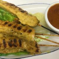Chicken Satay · Marinated and grilled chicken on skewer, served with peanut sauce.