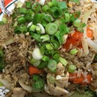 Fried Rice (Chicken Or Pork) · Fried rice with egg, meat, broccoli, carrot, onion, and tomato.