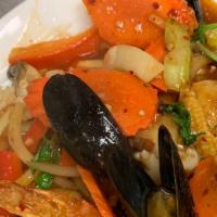 Spicy Combination Seafood · Stir fried fish, squid, prawn, scallop and mussel with bell pepper, baby corn, carrot, celer...