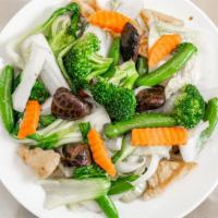 Buddhist Delight / Rau Xào Thập Cẩm · Stir-fried bamboo shoot, mushrooms, carrots, baby corn, tofu, broccoli and onion.