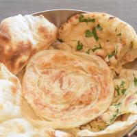 Aloo Paratha (Stuffed Potato) · Unleavened dough stuffed with a mixture of mashed potato and spices, rolled out, and cooked ...