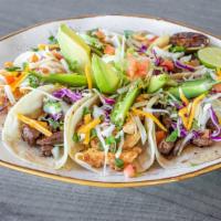 Street Tacos · Tacos are served with refried beans, spanish rice, onions, cilantro, lime, and habanero sals...