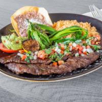 Carne Asada Plate *Gf · Skirt steak cooked to perfection, served with
green onions, lightly fried jalapeño, pico de
...