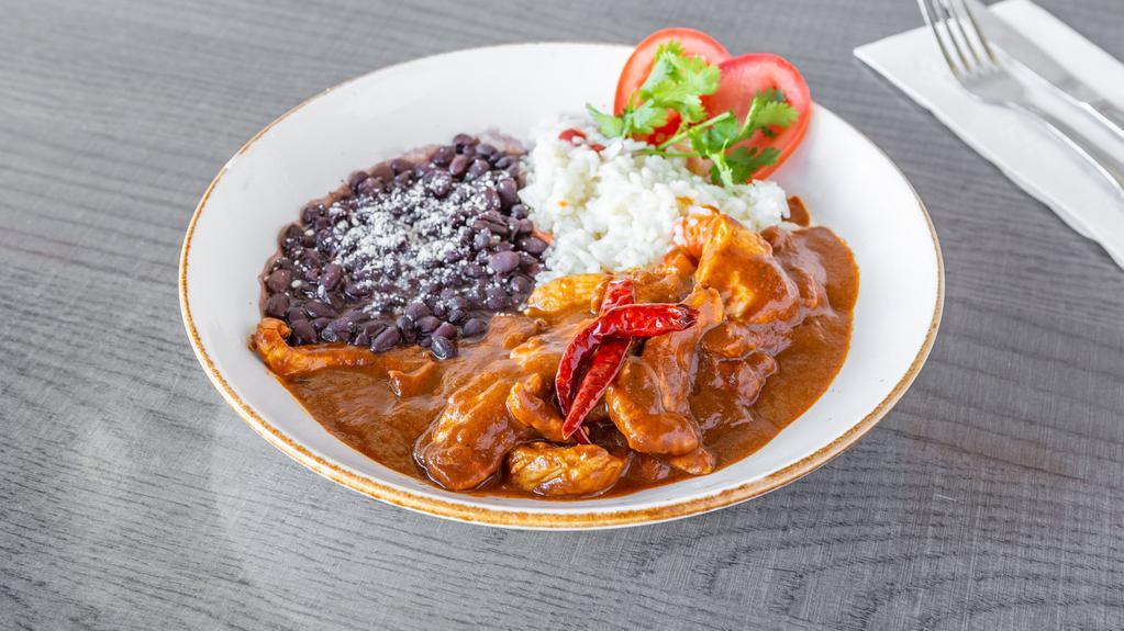 Pollo Con Mole *Gf · Tender chicken breast in a dark-red sweet and
spicy Mexican sauce, consisting of Mexican
chocolate, peanut butter and cinnamon
